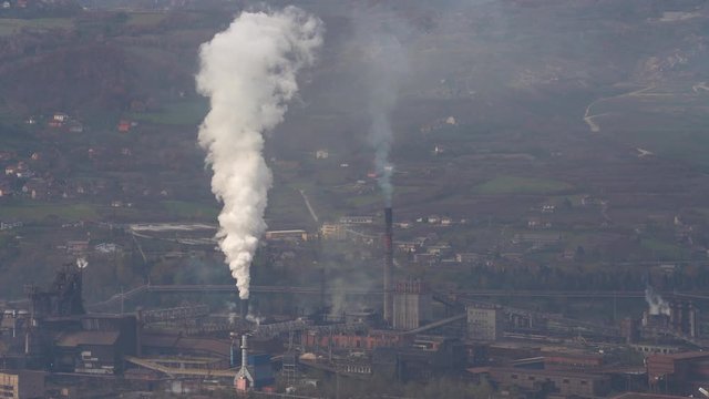 Industrial factory pollution, large smoke from pipes in atmosphere, near city, unclean air, poor visibility, stuffy - (4K)