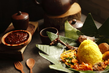 Tumpeng - Indonesian coned-shaped rice dish with chicken and vegetables