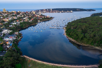 Fototapeta premium Boats sailing out of a channel in Northern Sydney