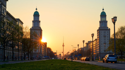 The Frankfurt Gate, inner-city Friedrichshain district of Berlin, beautiful yellow sunset with view of the tv tower