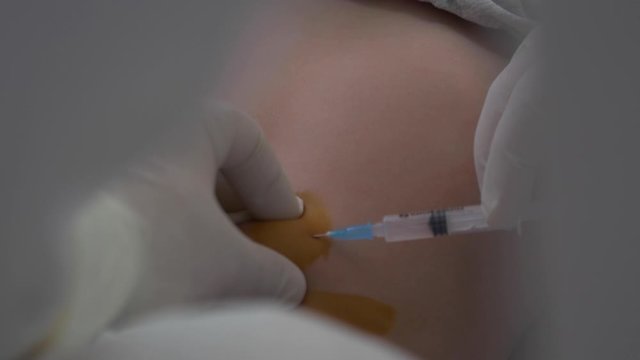 the child is given an injection in the stomach