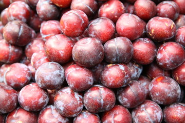 Lots of delicious looking very fresh peaches on sale at an outside market on a sunny Saturday. 