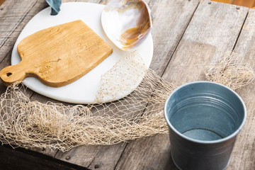 Rustic coastal beach style table with nautical items 