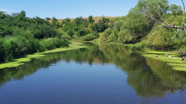 Flying over the river, shooting from a drone. Beautiful aerial view