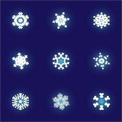 Set of christmas cut-out snowflakes on blue background.