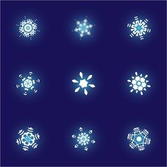Kit of simple, beautiful snowflakes on blue background.