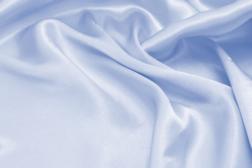 Obraz premium Draped satin blue fabric for festive backgrounds