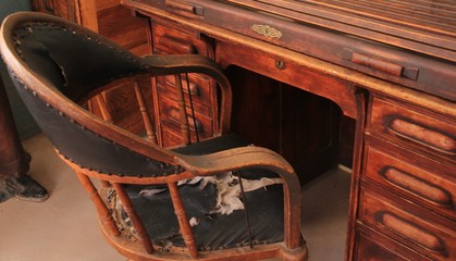 Old western chair at desk