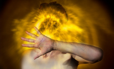Portrait of a woman who feels sick. Flashy lights around her head symbolize physical and...
