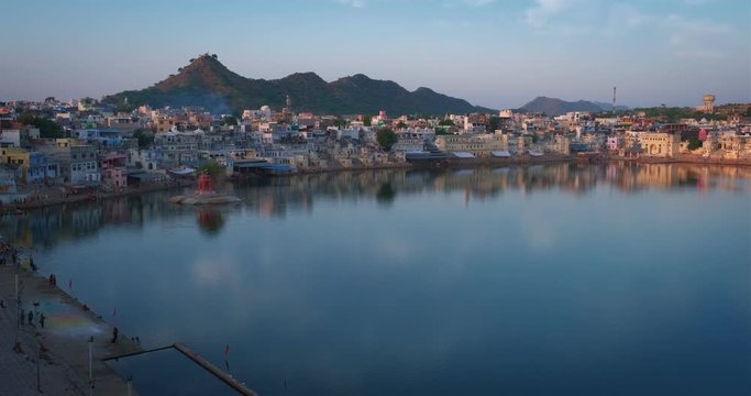 View of famous indian hinduism pilgrimage town sacred holy hindu religious city Pushkar with Pushkar ghats. Rajasthan, India. Horizontal pan