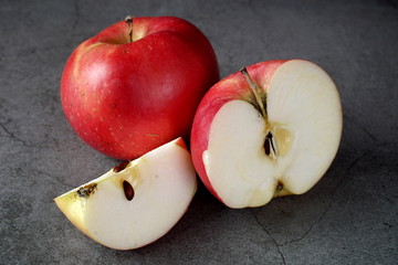 Red apples on a dark background. Selective focus