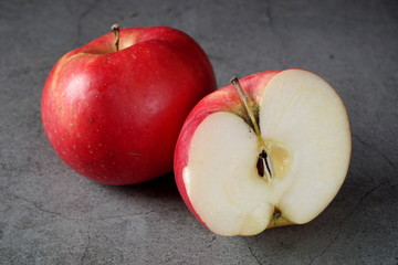 Red apples on a dark background. Selective focus