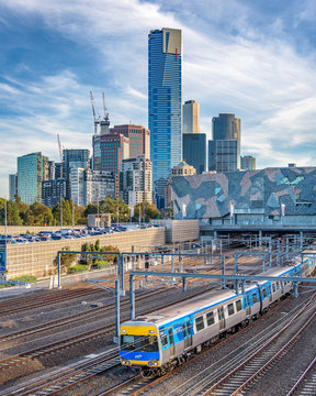 MELBOURNE, VICTORIA/AUSTRALIA May 26: The many highrise buildings of southbank in the city of Melbourne with a Metro train in the foreground in the late afternoon light on May 26th, 2018.