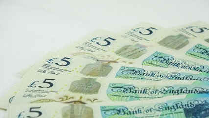 British £5  pounds sterling bills or banknotes