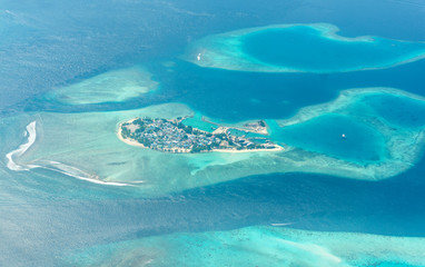 Maldive Island Top view drone shot of world famous island colorful sea and atolls