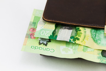 Canadian $20 dollar bills on a wallet