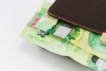 Canadian $20 dollar bills on a wallet
