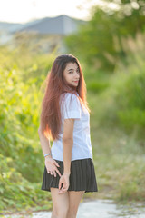 Portrait of asian or thai student university uniform beautiful girl relax and smile