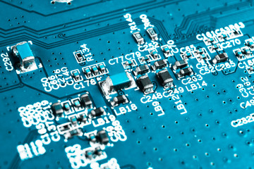 Macro shot of Circuit board with resistors microchips and electronic components. Computer hardware...
