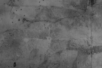 Texture of a concrete wall with cracks and scratches which can be used as a background