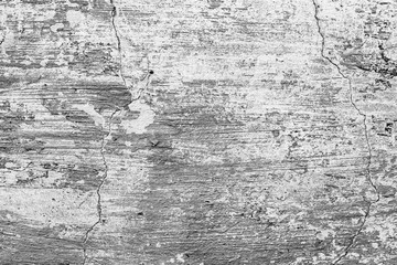 Texture of a concrete wall with cracks and scratches which can be used as a background