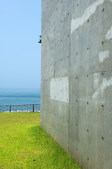 Exposed concrete wall by the sea. 