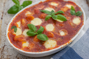 baked italian gnocchi with tomato sauce and parmesan cheese
