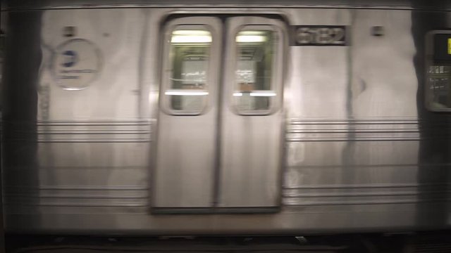 Fast moving subway train, metro, at New York City transportation.