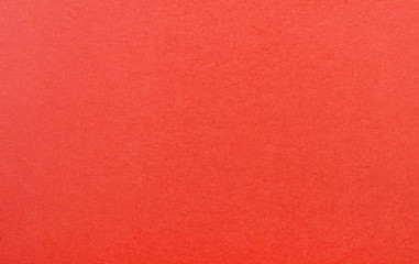 Plain red background. Red cardboard. Red paper texture background. Abstract geometric flat composition. Copy spaces