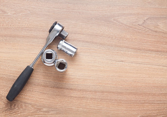 set of tools on wood background top view