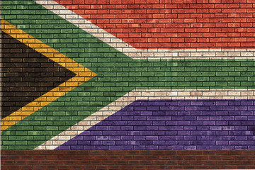 brick wall with painted flag of south africa concept