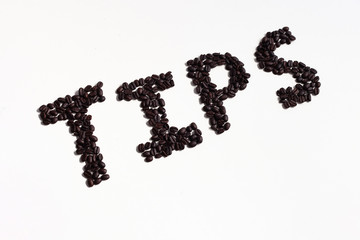 tips sign written in coffee beans