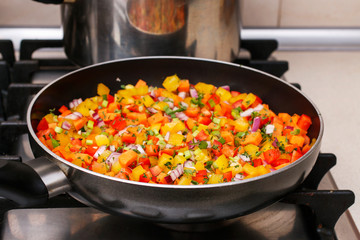 Mixed vegetables on a frying pan.