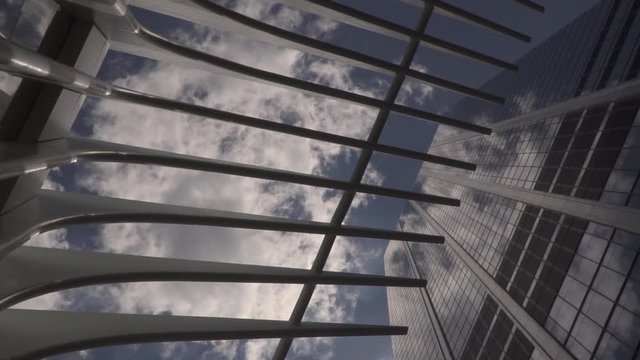 This was taken at a higher frame rate and has been converted to a slow motion video clip. Exterior shot looking up at the Oculus in New York City.