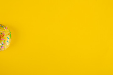 colorful doughnuts yellow background studio