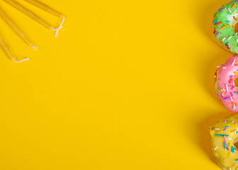 colorful doughnuts yellow background studio