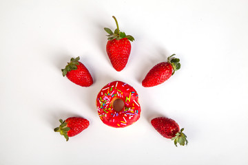 red doughnut strawberries white background