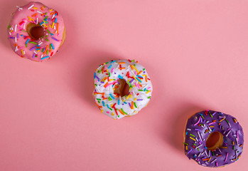 colorful doughnuts pink background studio