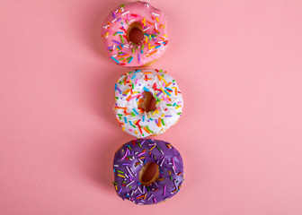 colorful doughnuts pink background studio