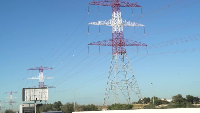 overhead power line wires, Electricity high voltage power pylon , uae street Ajman .