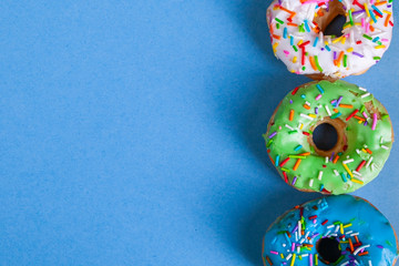 colorful doughnuts blue background studio