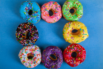 colorful doughnuts blue background studio