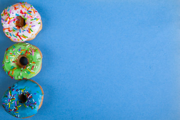 colorful doughnuts blue background studio
