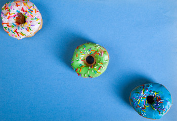 colorful doughnuts blue background studio