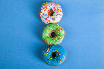 colorful doughnuts blue background studio