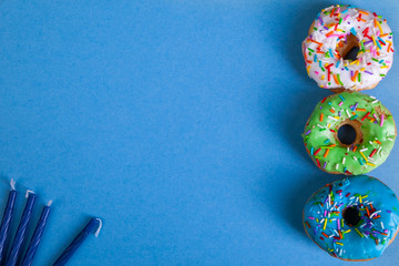colorful doughnuts blue background studio