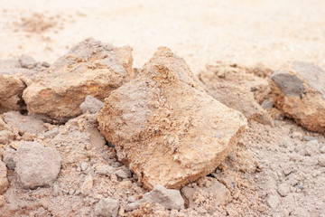 Lateritic soil heaped on the ground in countryside.