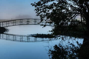 Small bridge above lake.