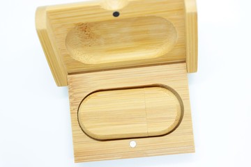 Wooden flash drive located on a white background