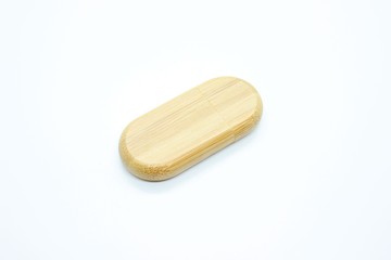 Wooden flash drive located on a white background